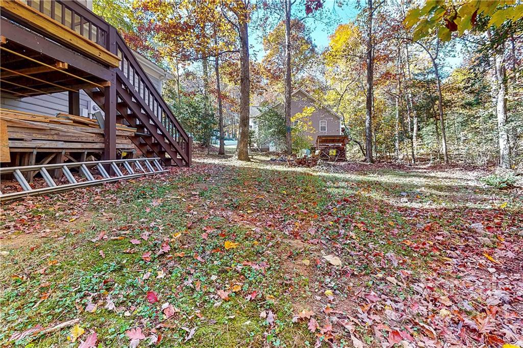 254 Bubbling Well Road Denver, NC 28037 - Photo 5 of 38 a view of a house with a yard