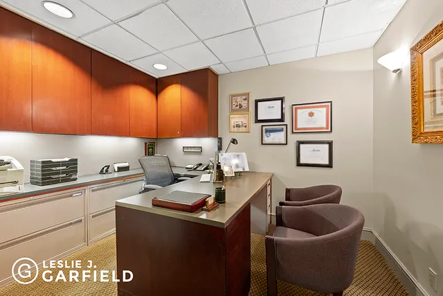 a living room with furniture a fireplace and a table