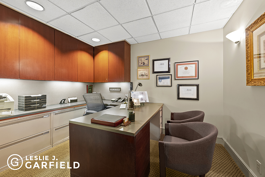 850 Park Avenue, Unit 1A/F Manhattan, NY 10075 - Photo 5 of 11 a kitchen with granite countertop a stove a sink and a counter
