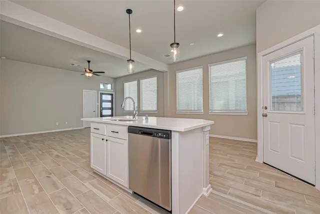 a kitchen with stainless steel appliances granite countertop a stove and a sink