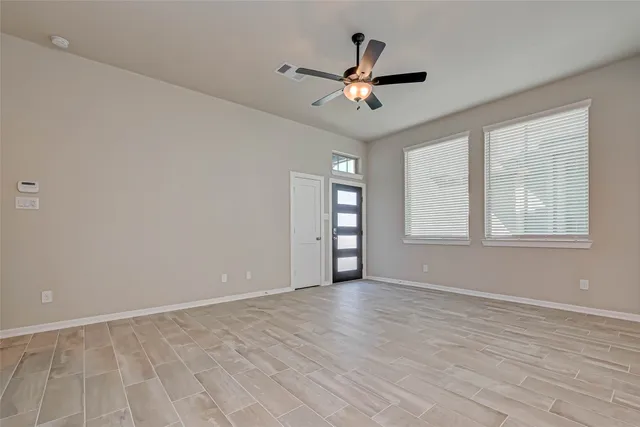a view of an empty room with a window