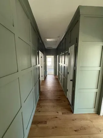 a view of gallery with wooden floor