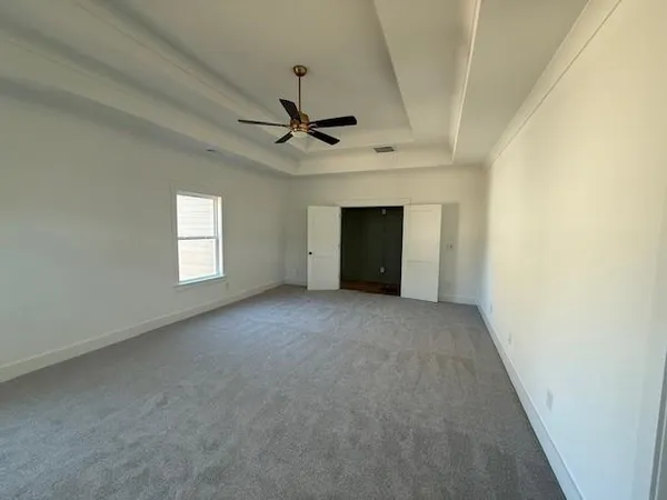 a view of an empty room with a fireplace