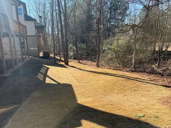 a view of a house with snow on the road