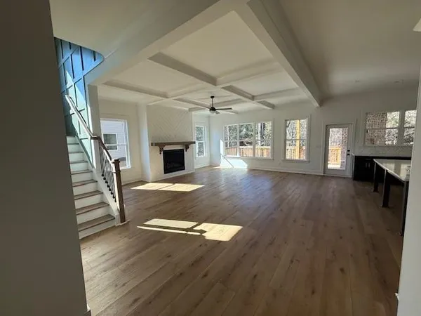 a view of entryway and hall with wooden floor