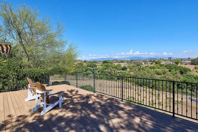 a living room with furniture fireplace and wooden floor