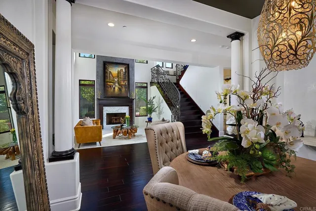 a living room with furniture fireplace and window