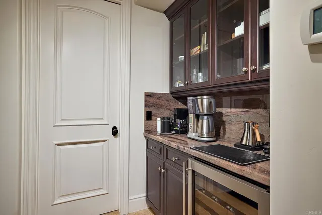 a kitchen with a stove a sink and a refrigerator