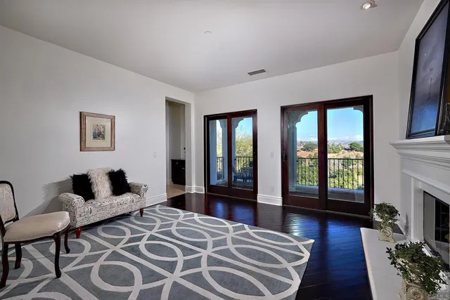 a view of a livingroom with furniture and a window