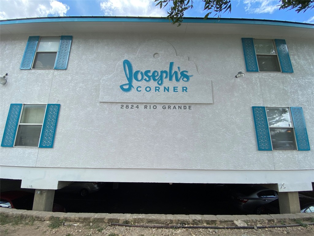 2824 Rio Grande Street, Unit 101 Austin, TX 78705 - Photo 1 of 10 a view of a living room that has a couch on the wall