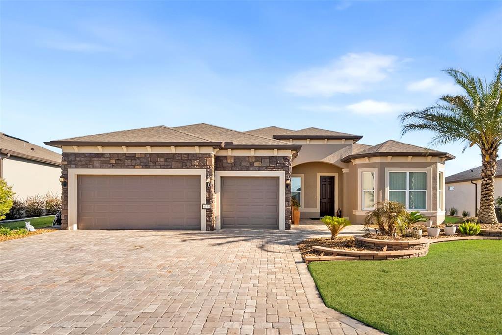 6135 Southwest 86th Circle Ocala, FL 34481 - Photo 1 of 51 a front view of a house with yard patio and swimming pool
