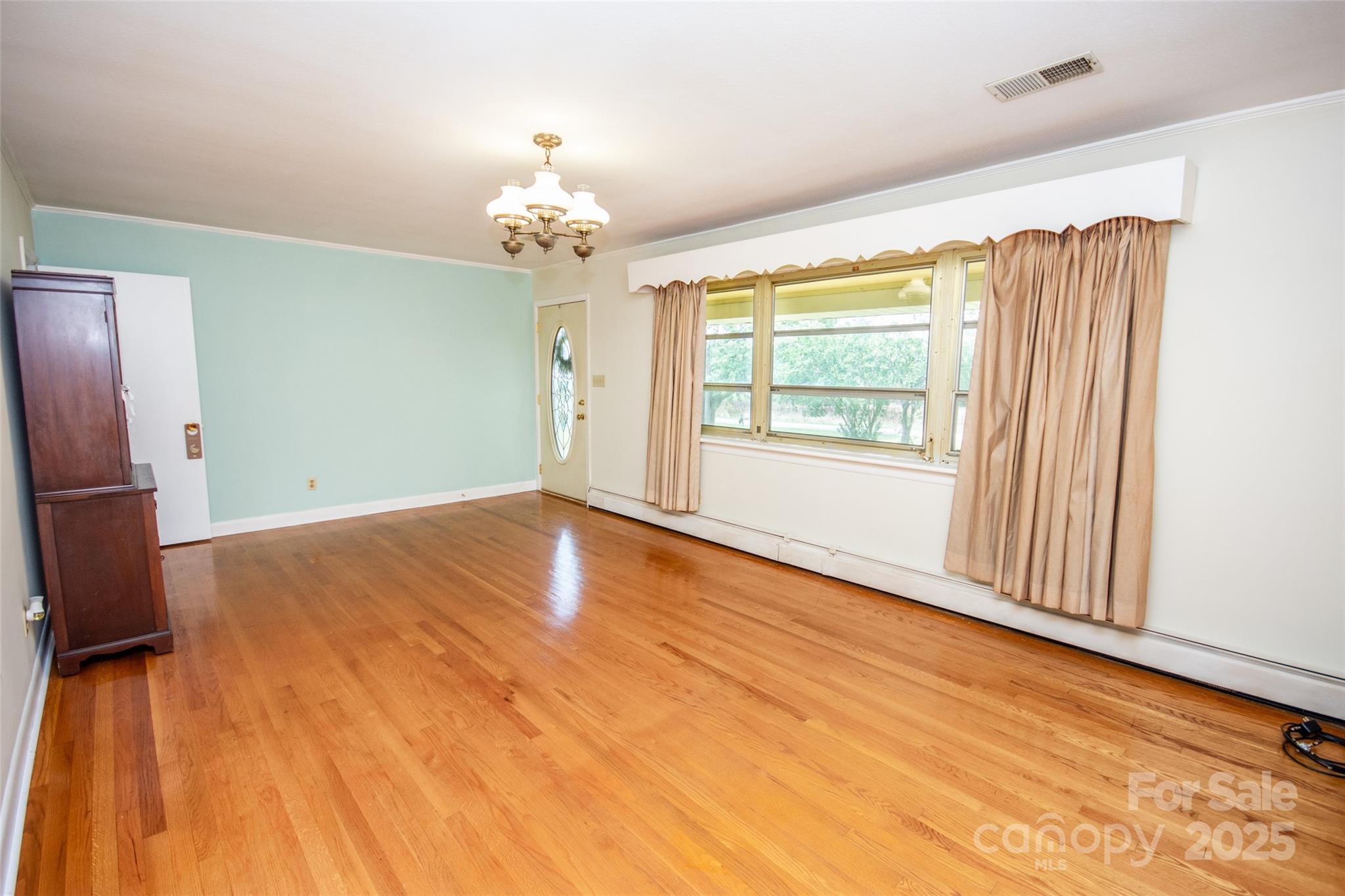 615 Bell Farm Road Statesville, NC 28625 - Photo 12 of 46 wooden floor in an empty room with a window