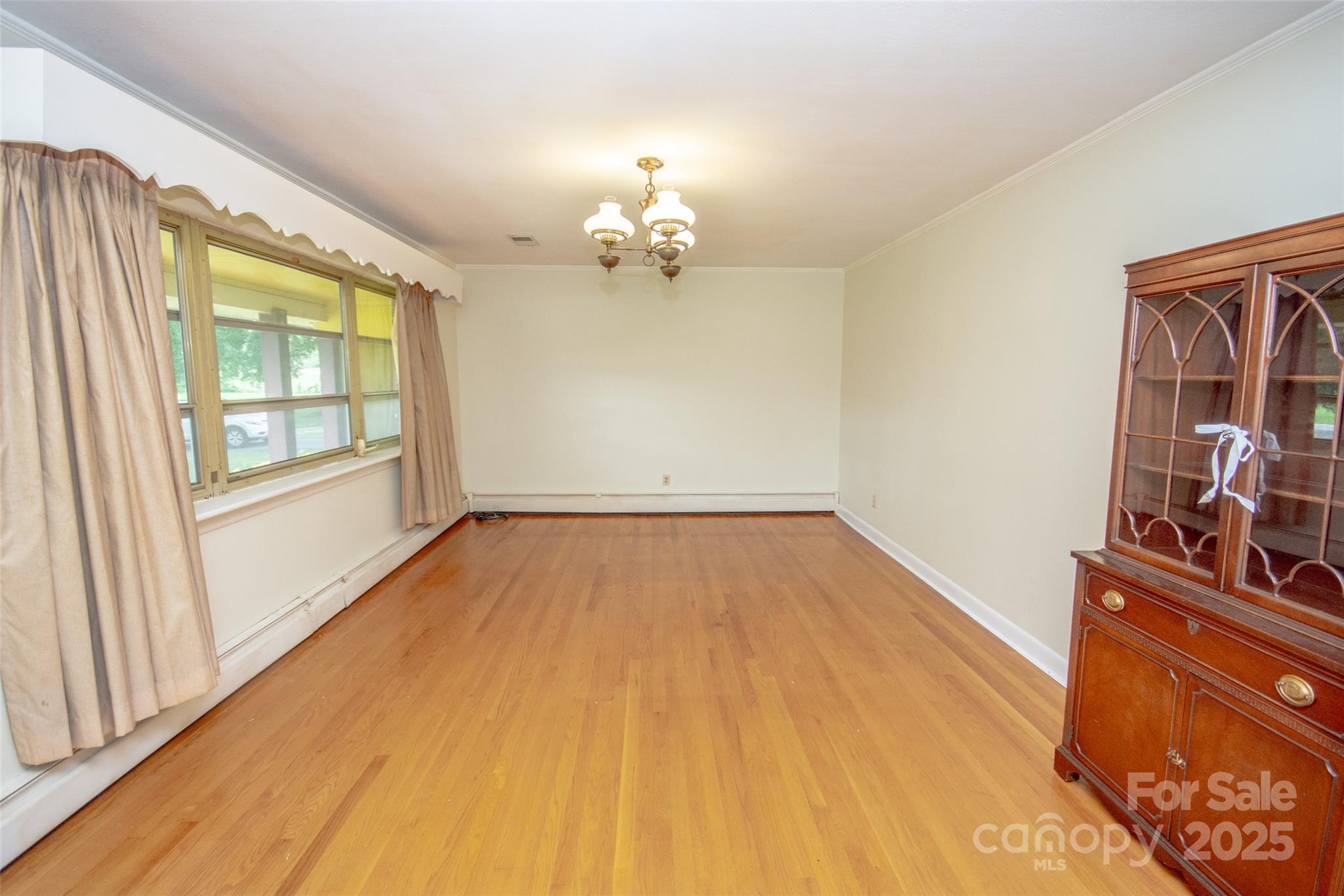 615 Bell Farm Road Statesville, NC 28625 - Photo 13 of 46 wooden floor in an empty room with a window