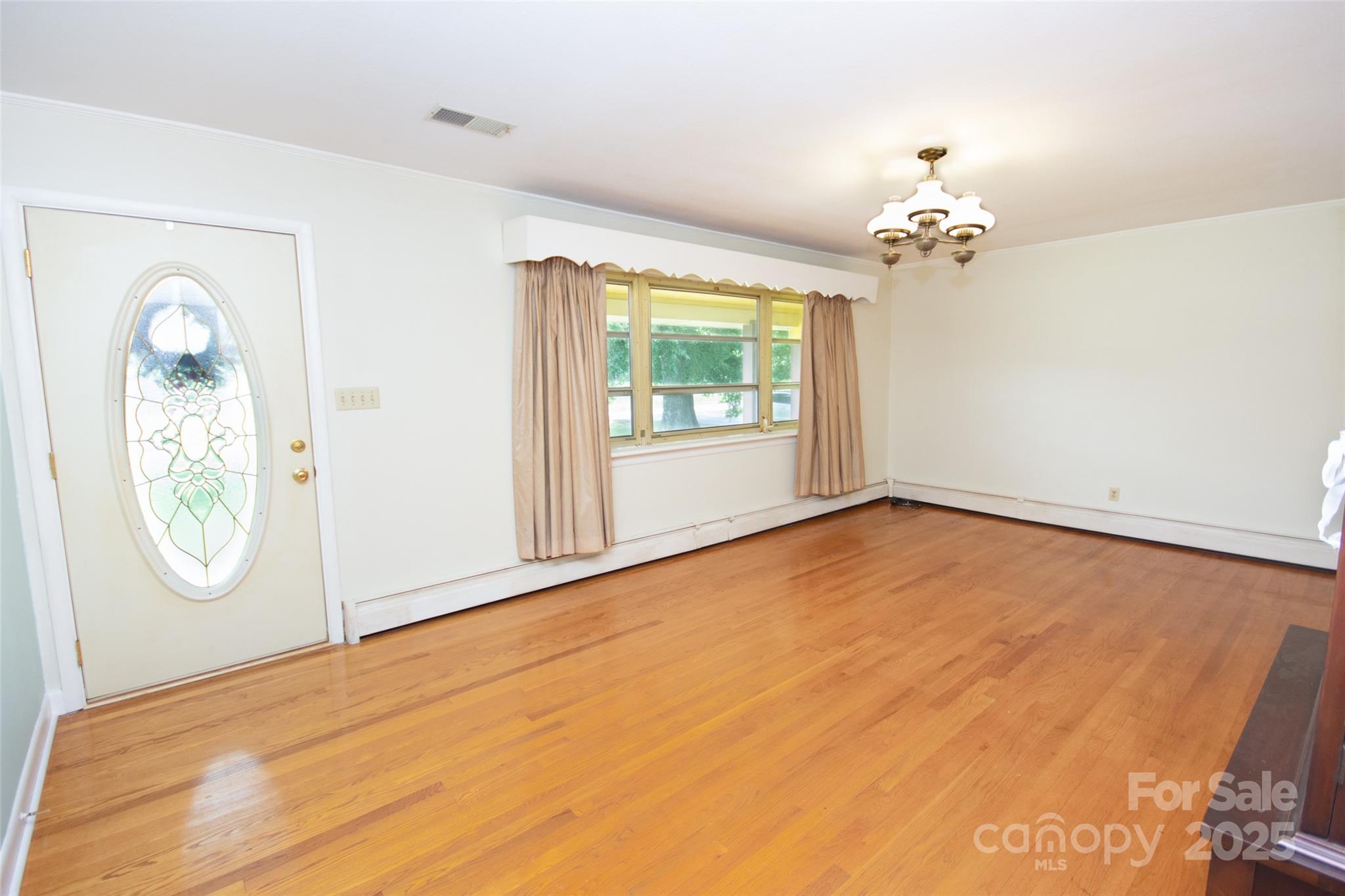 615 Bell Farm Road Statesville, NC 28625 - Photo 14 of 46 wooden floor in an empty room with a window