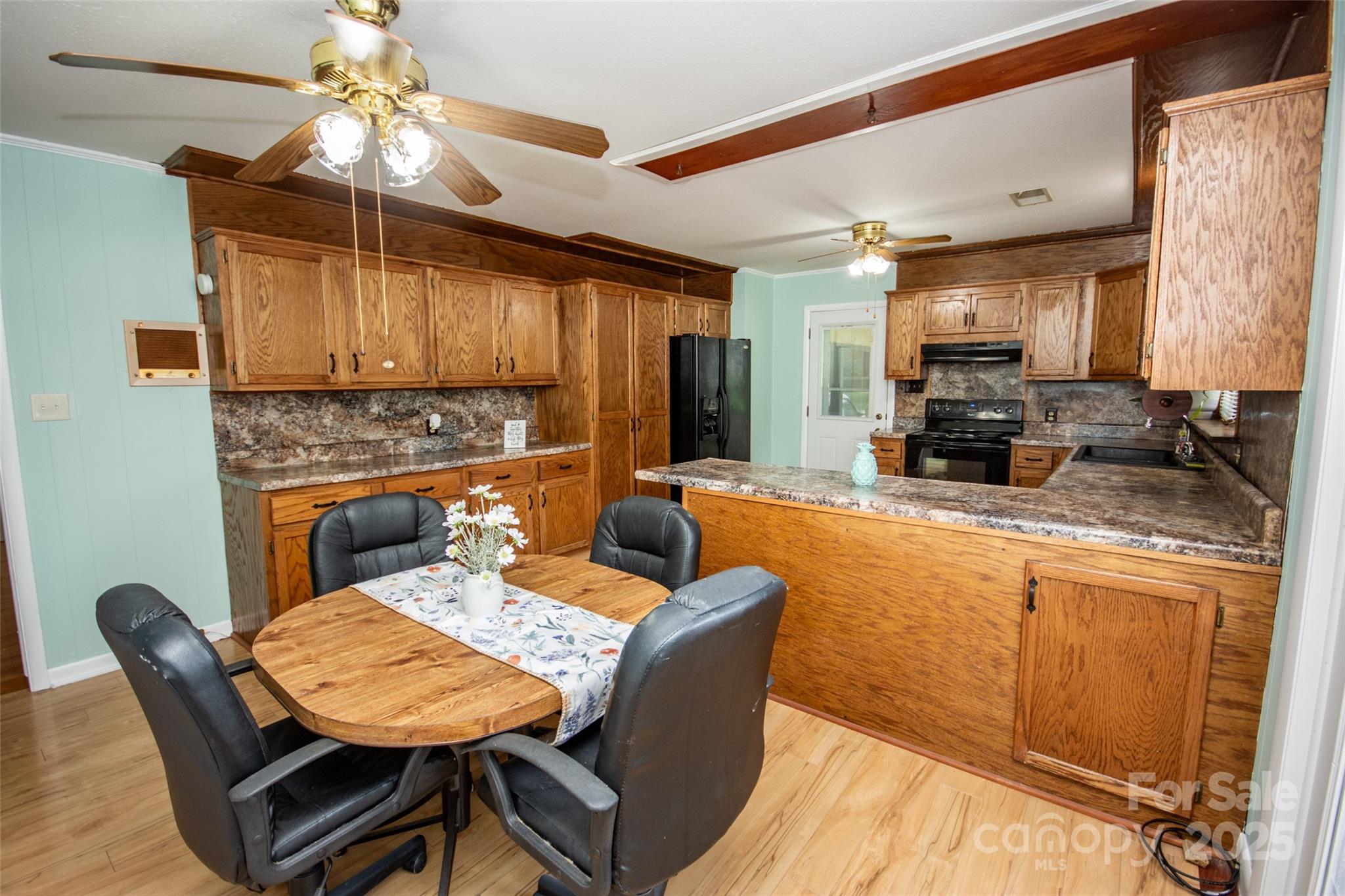 615 Bell Farm Road Statesville, NC 28625 - Photo 16 of 46 a view of a dining room with furniture window and wooden floor