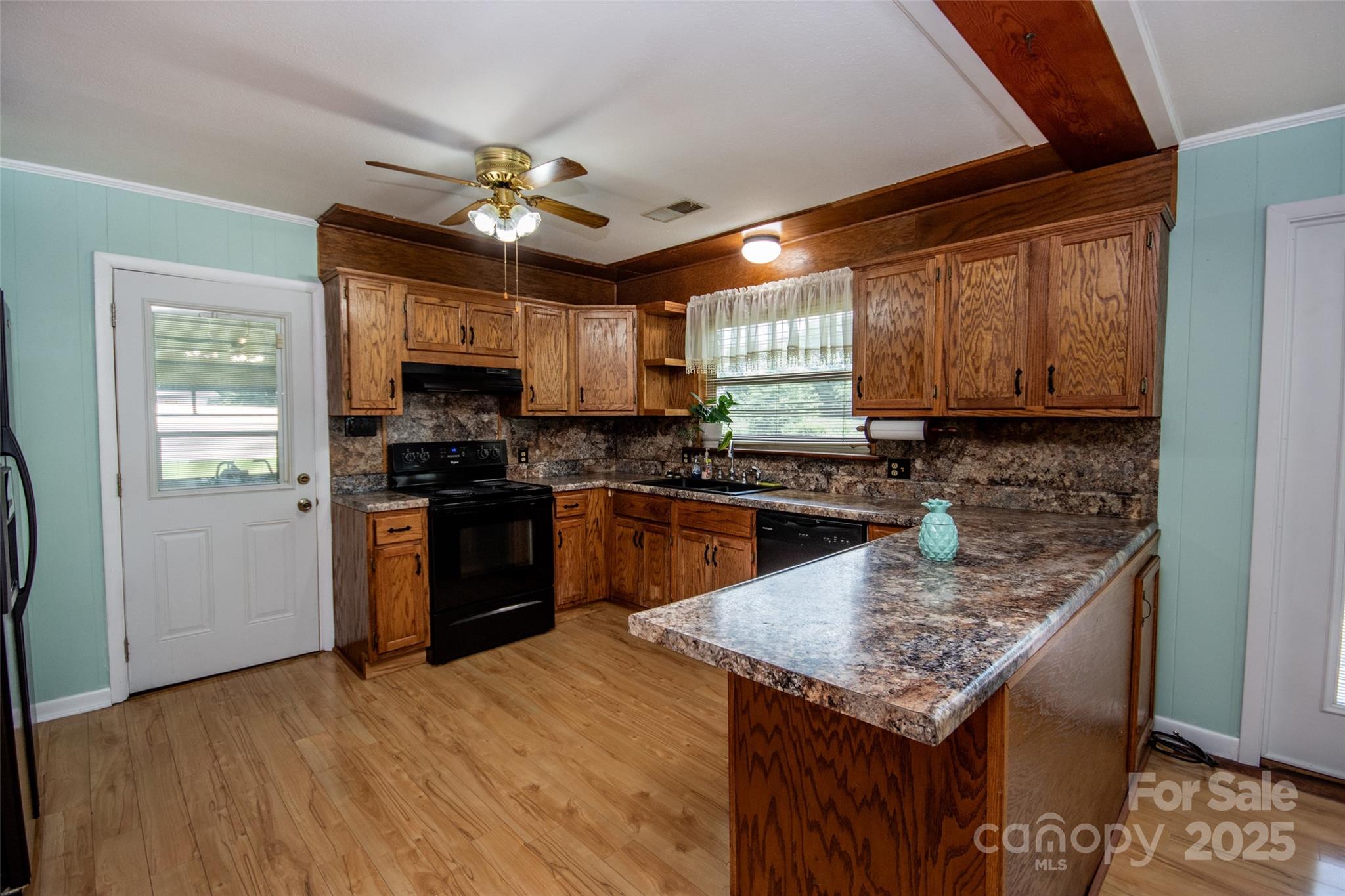 615 Bell Farm Road Statesville, NC 28625 - Photo 17 of 46 a kitchen with a sink a counter space cabinets and appliances