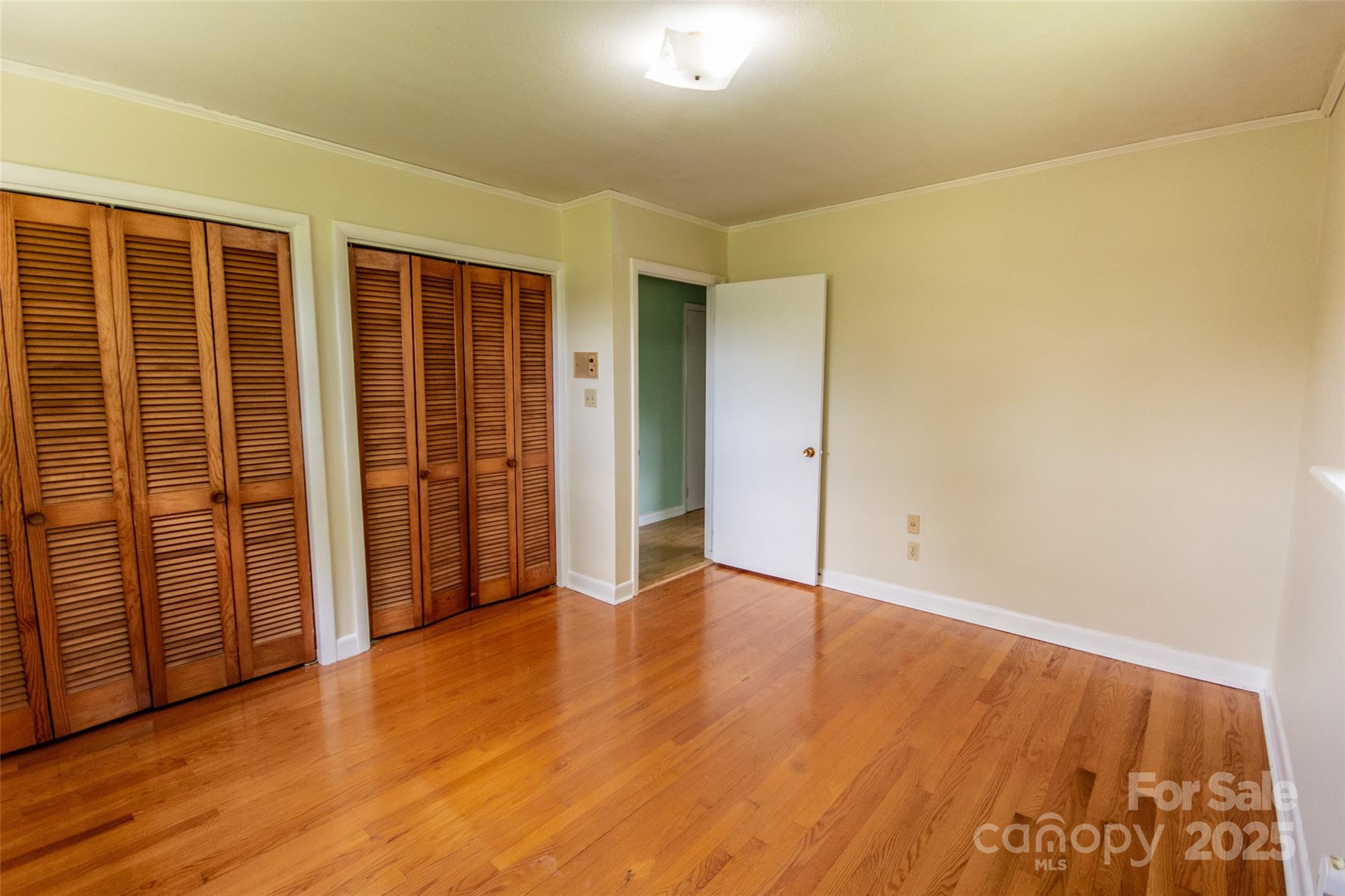 615 Bell Farm Road Statesville, NC 28625 - Photo 24 of 46 wooden floor in an empty room with a window