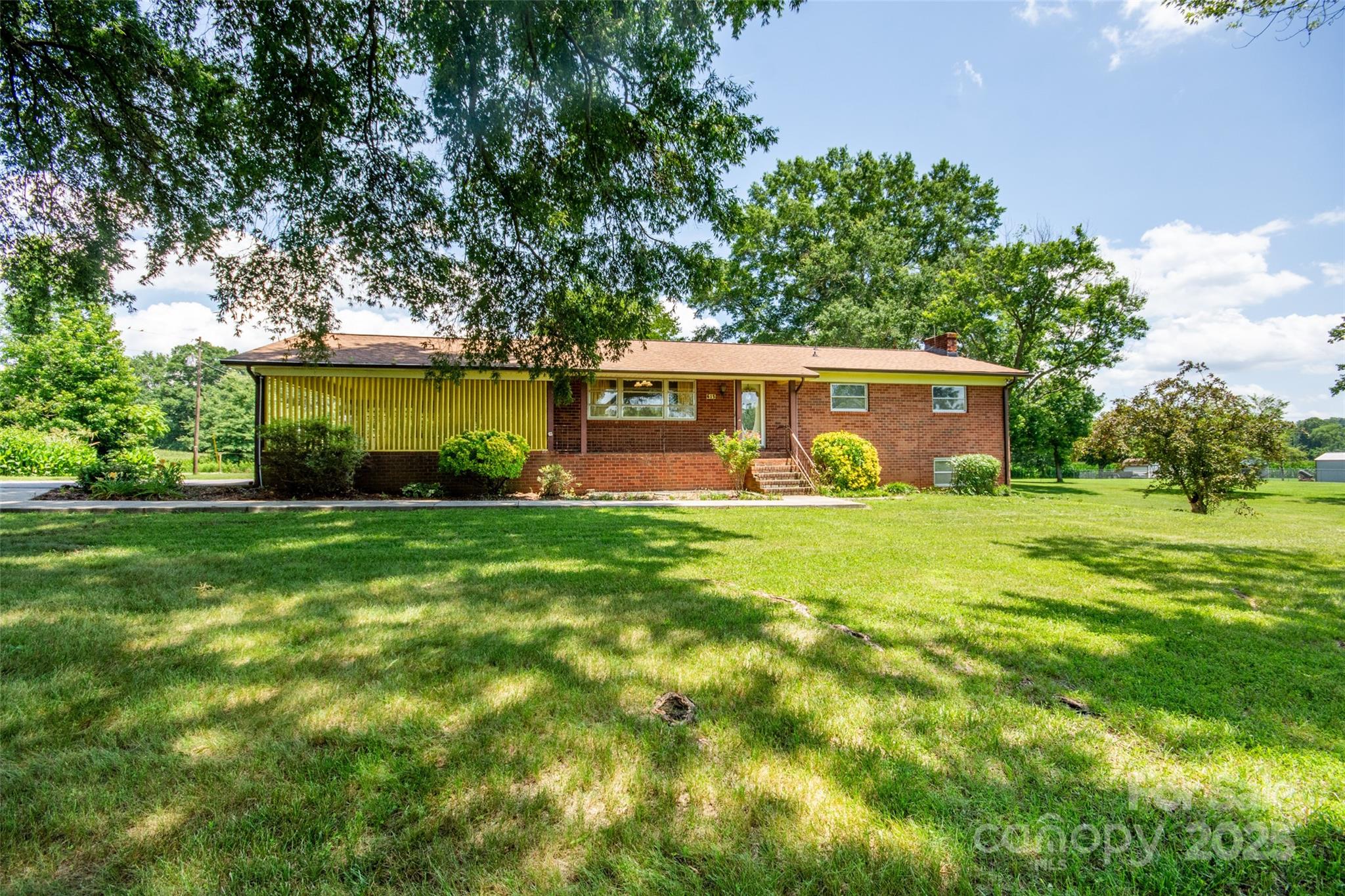615 Bell Farm Road Statesville, NC 28625 - Photo 3 of 46 a view of a house with a backyard