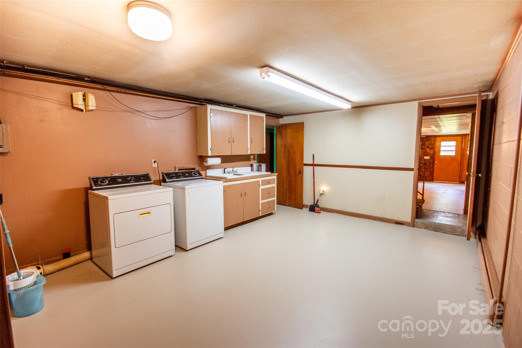 615 Bell Farm Road Statesville, NC 28625 - Photo 31 of 46 a view of a kitchen with a sink dryer and washer