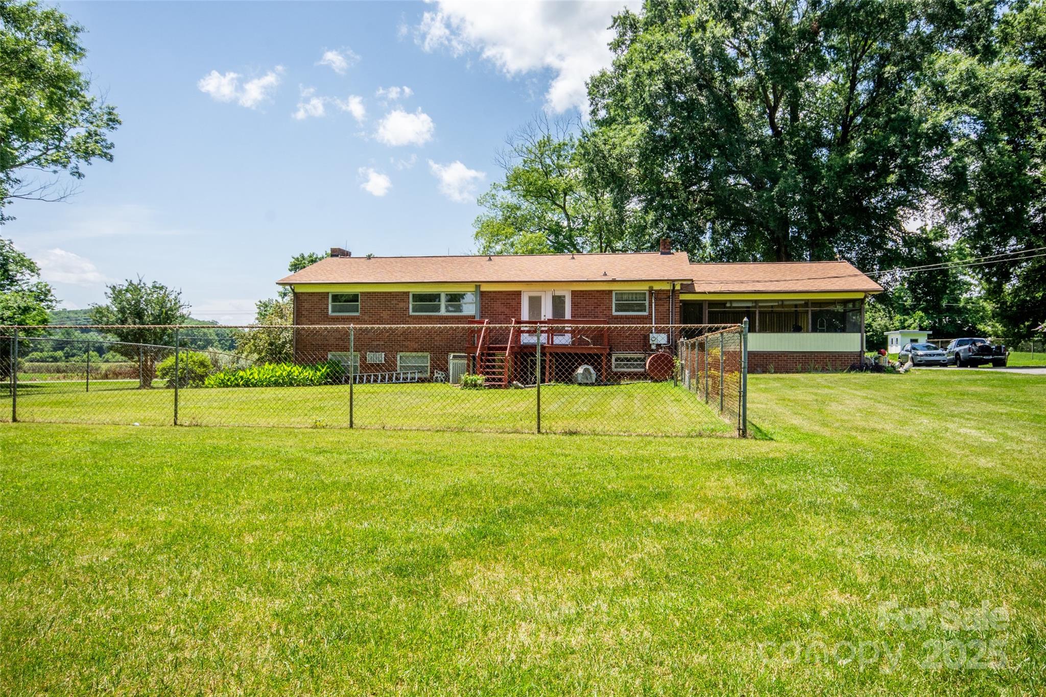 615 Bell Farm Road Statesville, NC 28625 - Photo 39 of 46 a view of a house with a backyard porch and sitting area