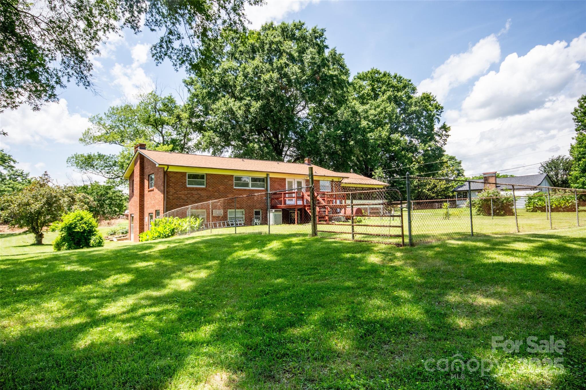 615 Bell Farm Road Statesville, NC 28625 - Photo 40 of 46 a view of a house with a backyard