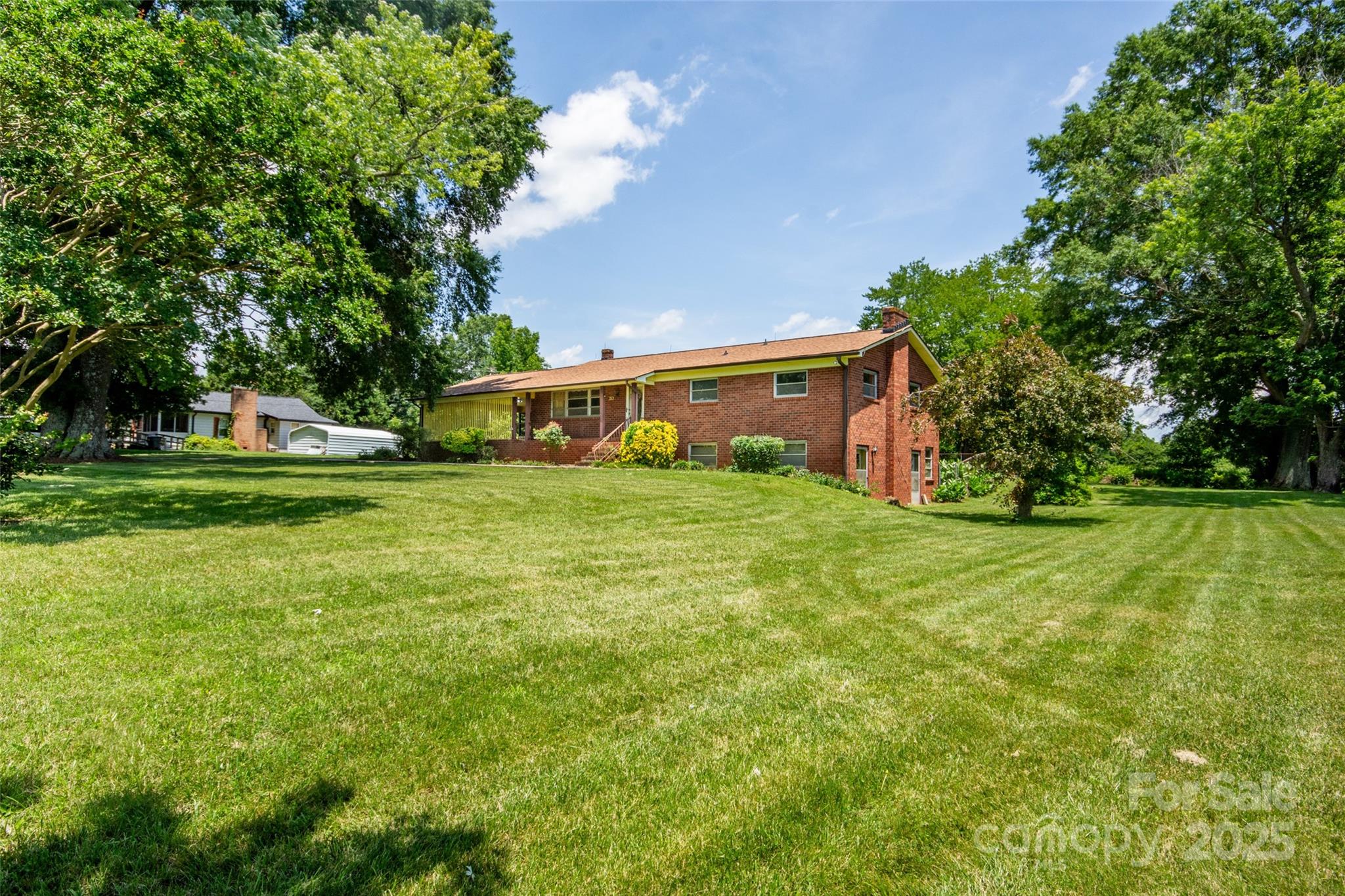 615 Bell Farm Road Statesville, NC 28625 - Photo 46 of 46 a view of a field of grass and trees