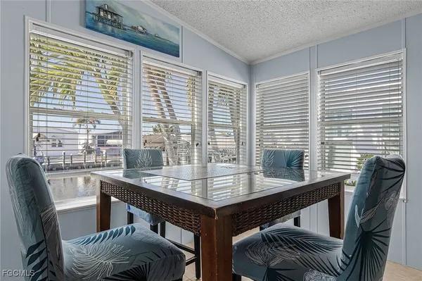 a dining room with furniture and windows