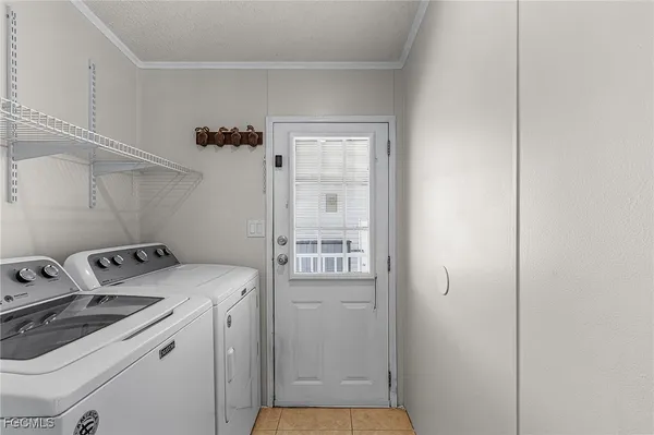 a view of storage and utility room with washer and dryer