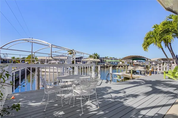 a view of a chairs and table in the patio