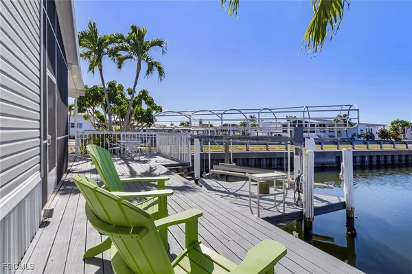 a view of roof deck with seating area and barbeque oven
