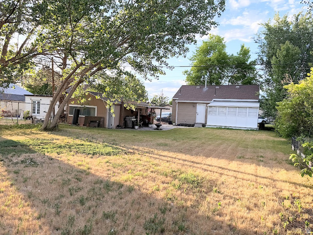737 Wasatch Street Midvale, UT 84047 - Photo 26 of 29 Expansive yard space featuring mature trees and established perimeter fencing