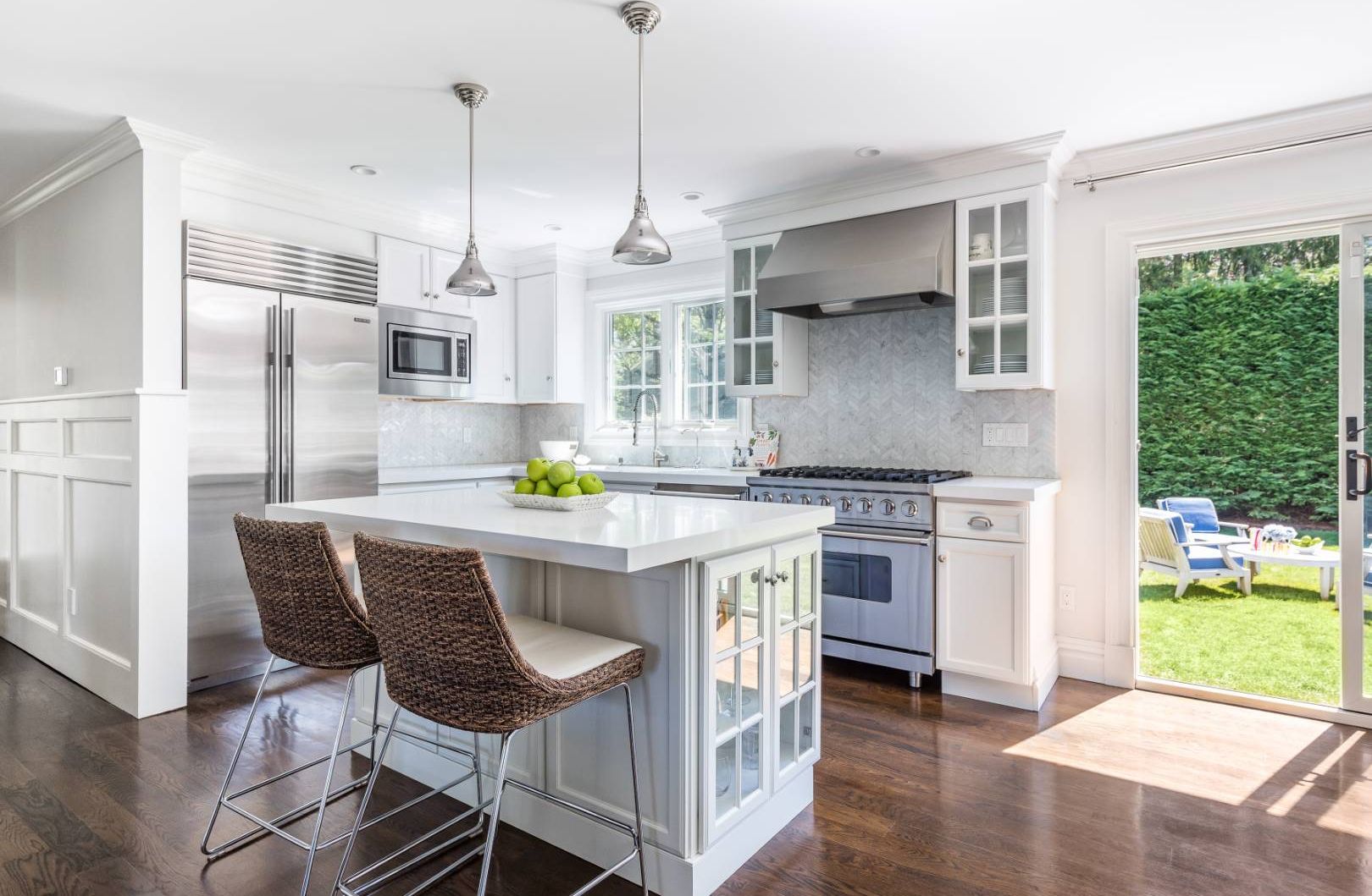 34 Sherrill Road East Hampton, NY 11937 - Photo 6 of 21 a kitchen with kitchen island a stove a sink a dining table and chairs