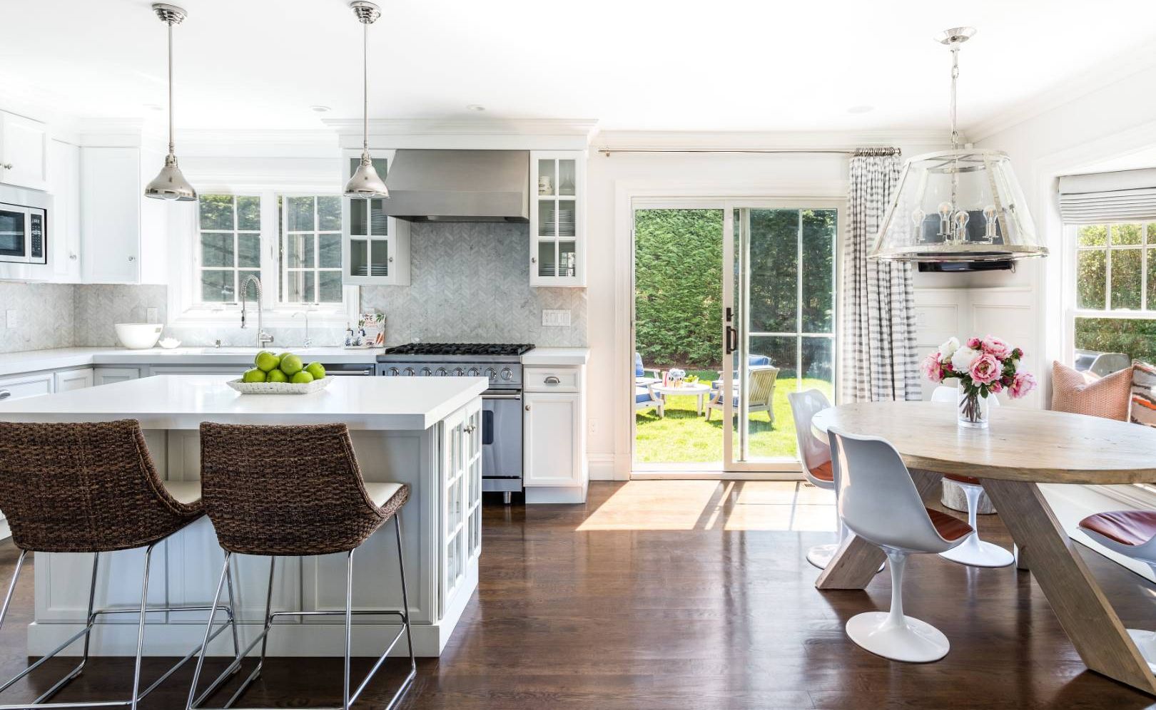 34 Sherrill Road East Hampton, NY 11937 - Photo 7 of 21 a kitchen with a table chairs stove and wooden floor