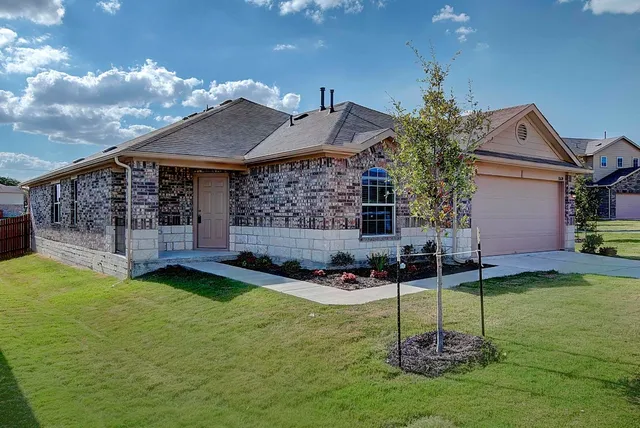 a house that has a big yard in front of it