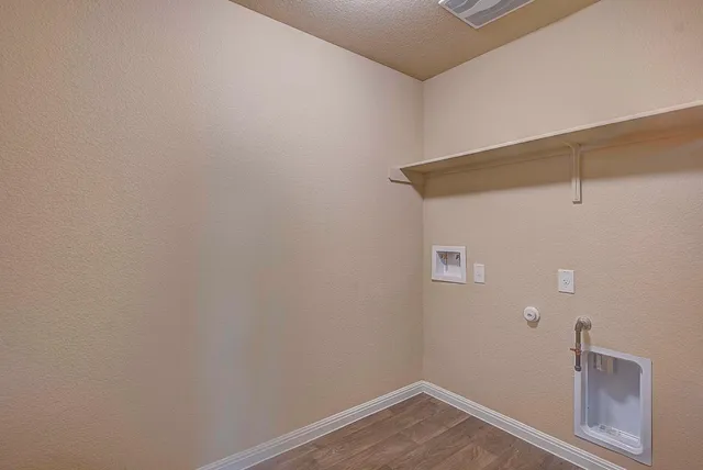 a view of small space with empty racks on the wall