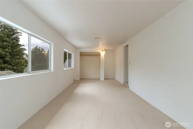 a view of a wooden deck and a backyard