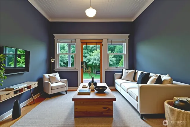 a living room with furniture and a flat screen tv