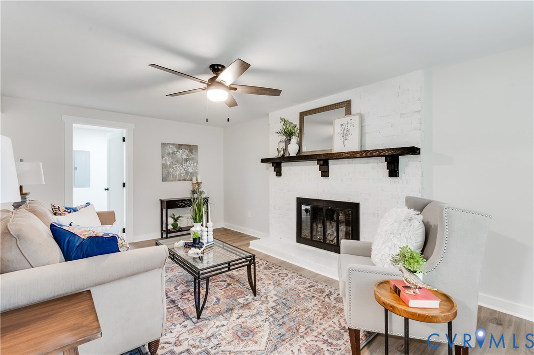 9324 Becar Road North Chesterfield, VA 23236 - Photo 19 of 33 Living area featuring a painted brick fireplace wi