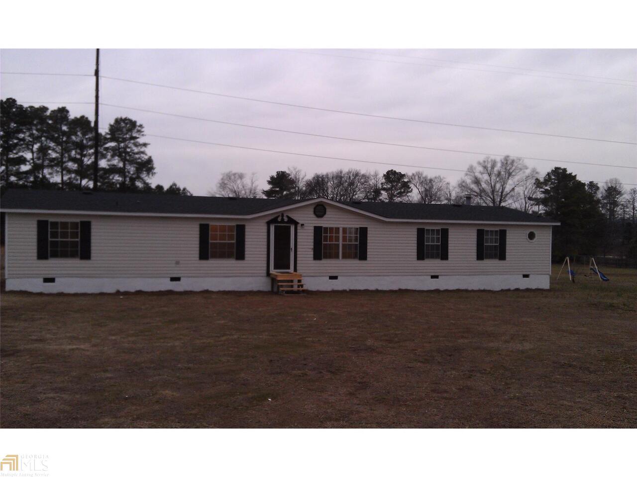 5433 Calhoun Road Northeast Adairsville, GA 30103 - Photo 1 of 1 a view of a big house with a big yard