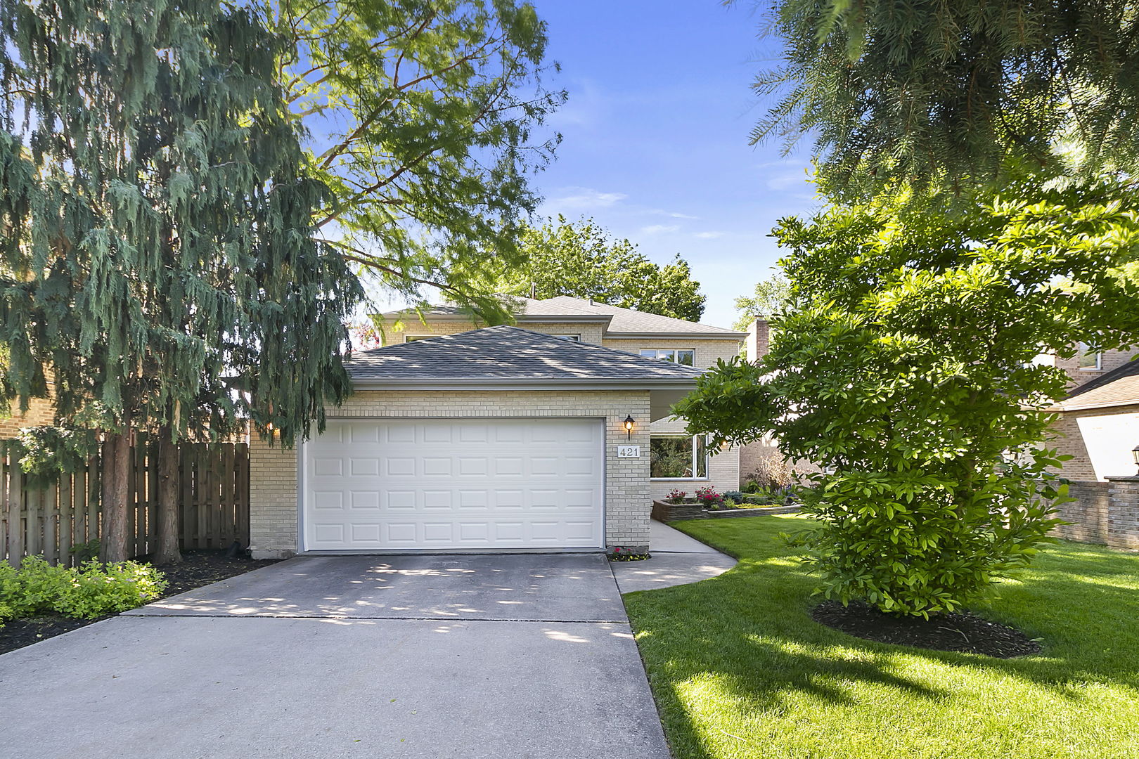 421 Herrick Road Riverside, IL 60546 - Photo 1 of 41 a front view of a house with a yard and a garage
