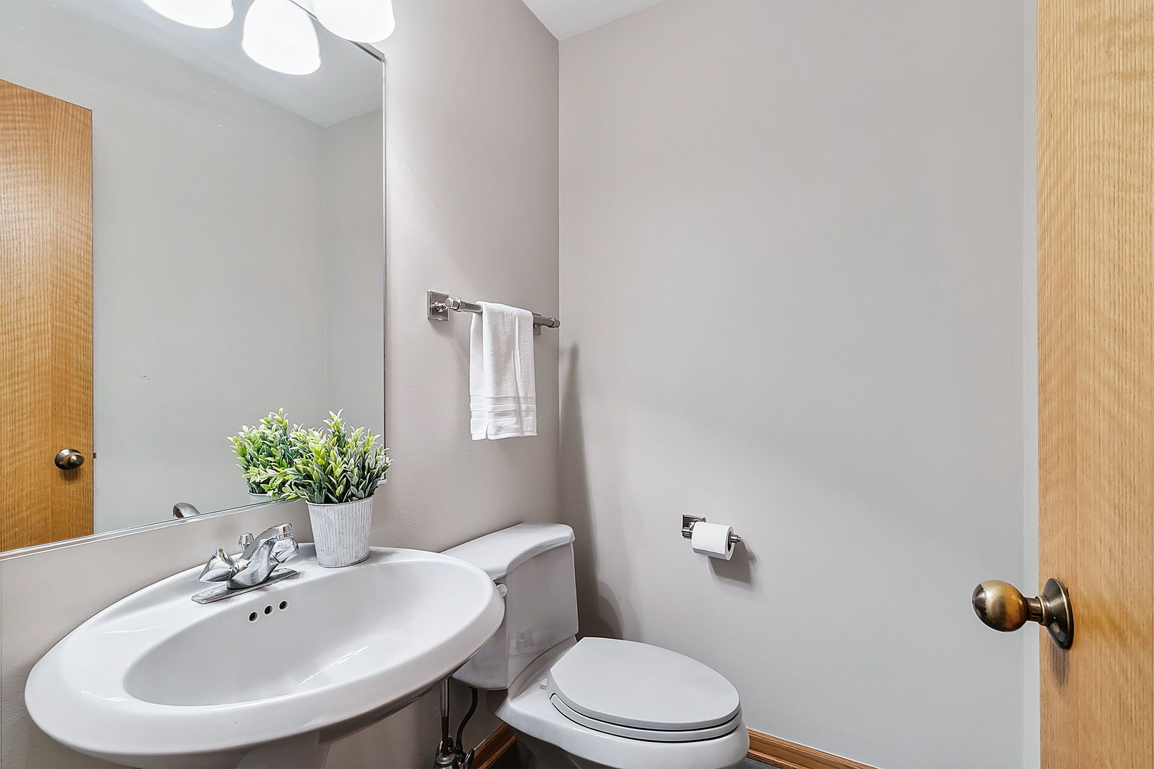 421 Herrick Road Riverside, IL 60546 - Photo 12 of 41 a bathroom with a sink a toilet and a mirror