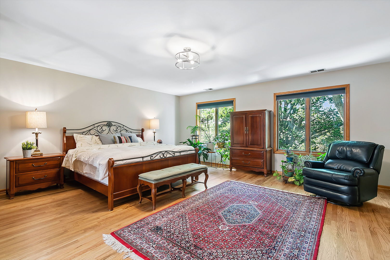 421 Herrick Road Riverside, IL 60546 - Photo 13 of 41 a bedroom with a bed and wooden floor