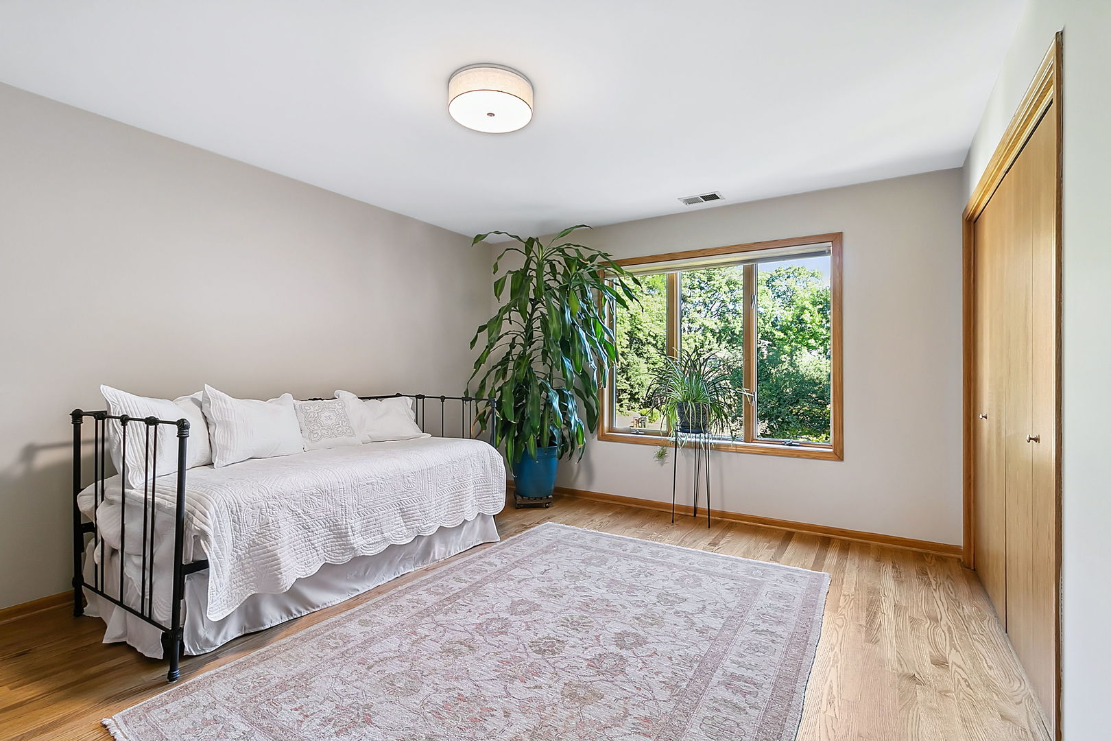 421 Herrick Road Riverside, IL 60546 - Photo 18 of 41 a spacious bedroom with a bed and a window