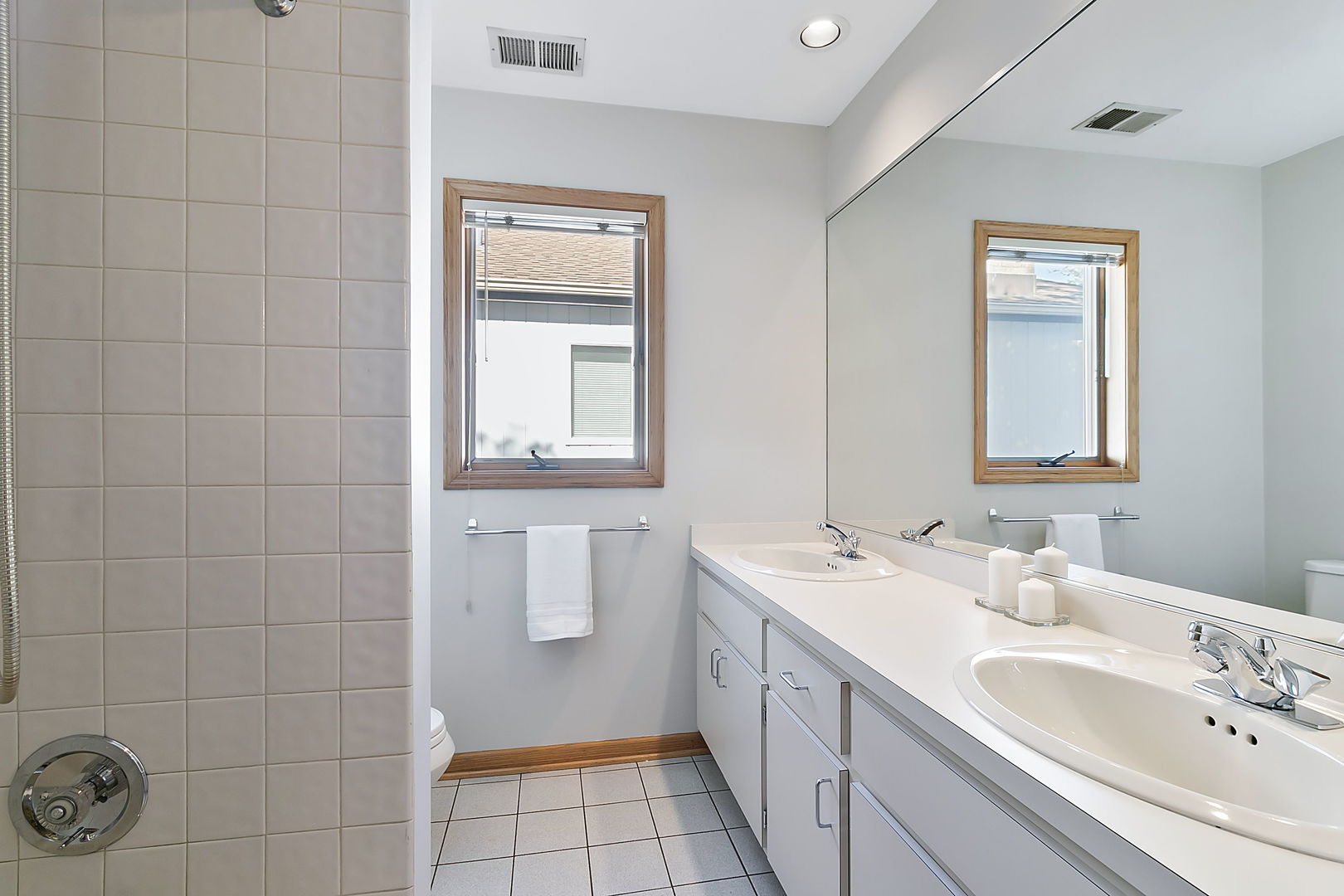 421 Herrick Road Riverside, IL 60546 - Photo 19 of 41 a bathroom with a sink a toilet and mirror