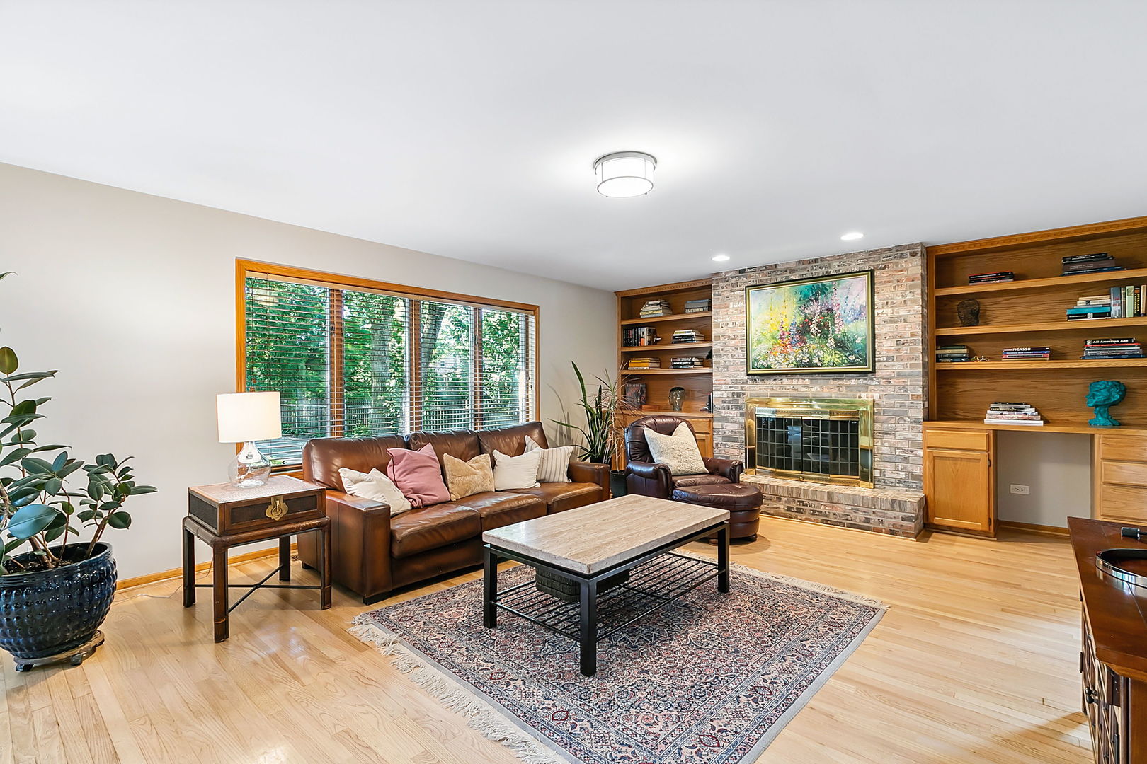 421 Herrick Road Riverside, IL 60546 - Photo 2 of 41 a living room with furniture and a fireplace