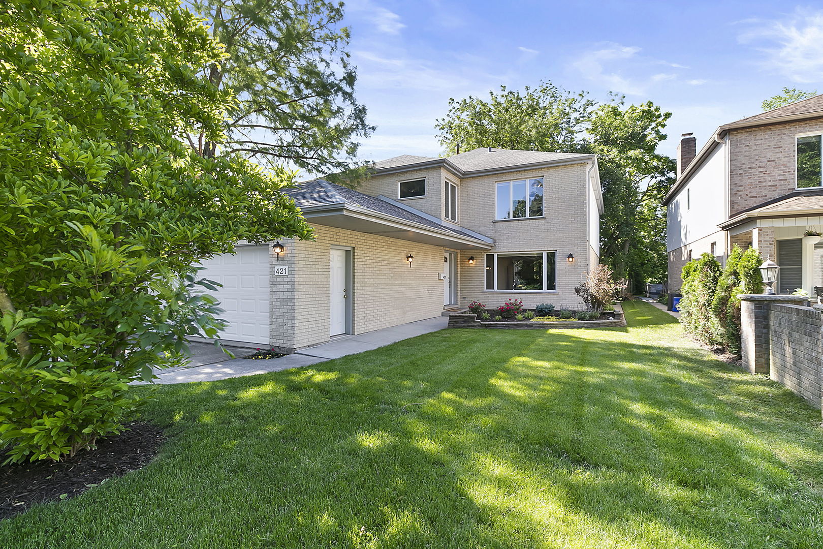 421 Herrick Road Riverside, IL 60546 - Photo 30 of 41 a front view of house with yard and trees