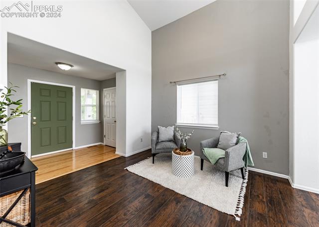 995 Winebrook Way Fountain, CO 80817 - Photo 5 of 44 Foyer entrance with high vaulted ceiling and wood-type flooring