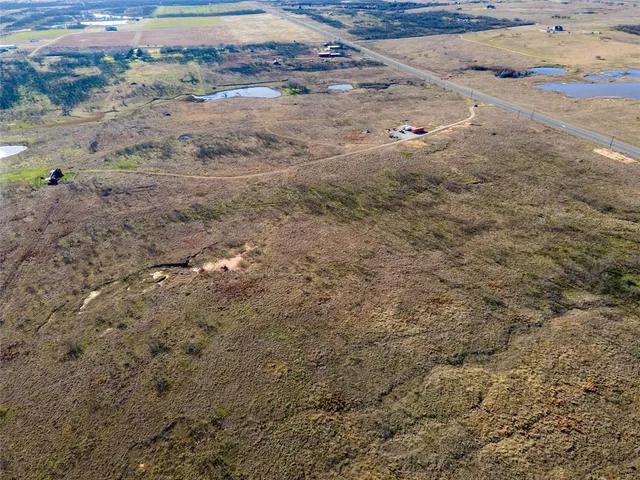 a view of outdoor space with wooden floor