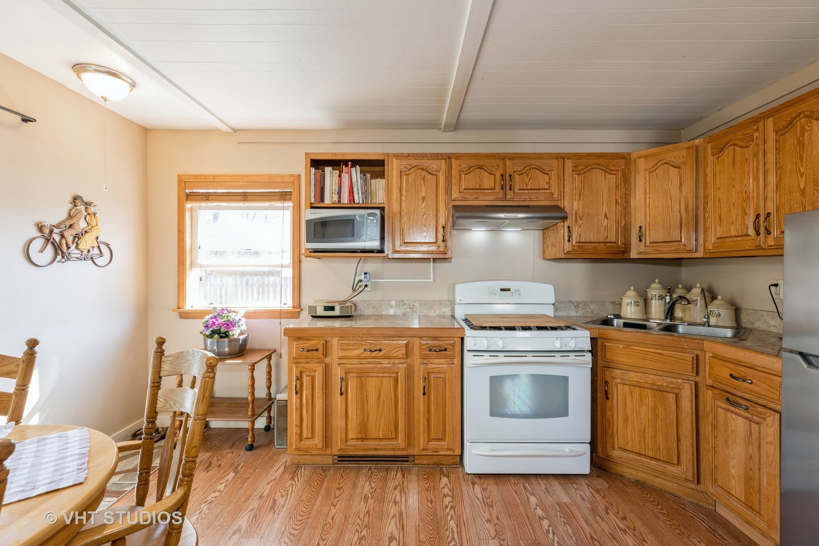 1438 Ridge Road Homewood, IL 60430 - Photo 31 of 35 a kitchen with a stove top oven sink and cabinets