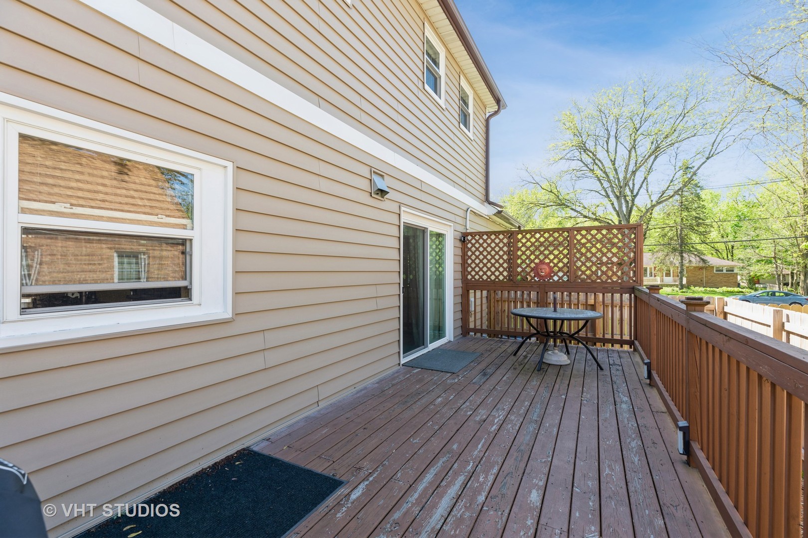 1438 Ridge Road Homewood, IL 60430 - Photo 4 of 35 a view of a deck with wooden floor and outdoor seating